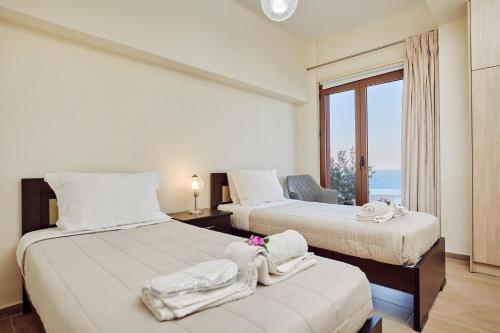 Postel nebo postele na pokoji v ubytování Jessica Luxury Villa