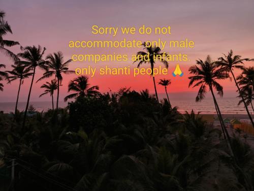 a sunset with palm trees and the words sorry we do not associate only make companies at FF space, beach property only for Shanti yoga people, MandremArambol Beach in Arambol