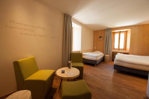 Voodi või voodid majutusasutuse Auberge de l'Hospice toas