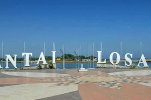 a sign with the words tamashaosolis in front of a building at Delft Apartment - Sea View Studio Flat at Losari Beach in Makassar