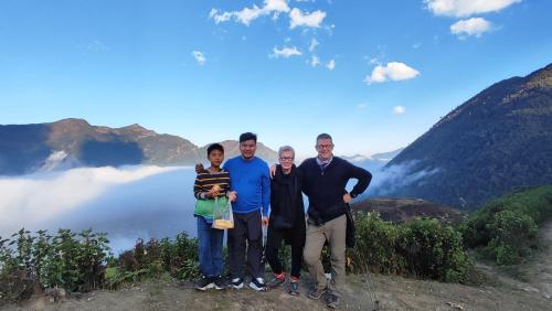 a group of people standing on top of a mountain at Tavan View Homestay in Sa Pa