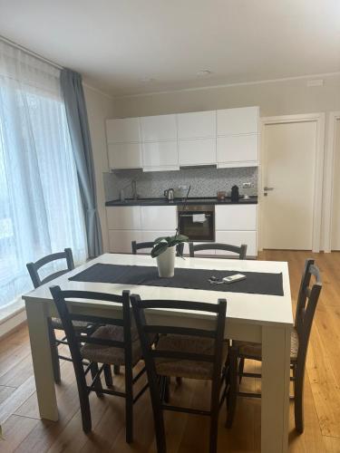 a kitchen and dining room with a table and chairs at Podere Belsogno-Miniappartamento Roseto in Montalcino