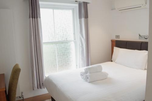Postel nebo postele na pokoji v ubytování Osborne Aparthotel