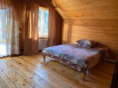 Ένα ή περισσότερα κρεβάτια σε δωμάτιο στο Cottage