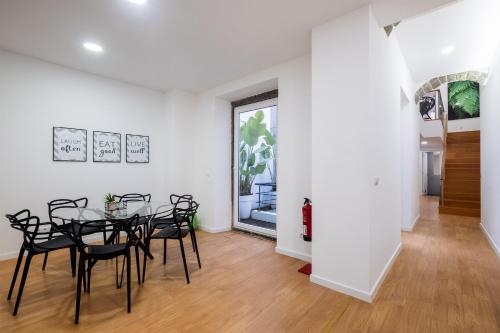 a dining room with a table and chairs at Ponta Delgada Flats - HOST & CHILL in Ponta Delgada
