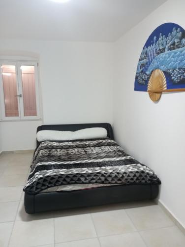 Appartement belle vue 07にあるベッド