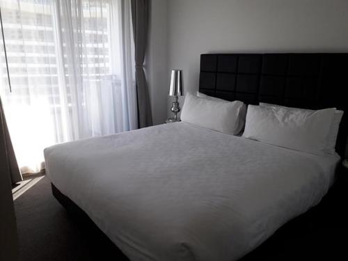 Ein Bett oder Betten in einem Zimmer der Unterkunft Khalifa Kodji Hotel