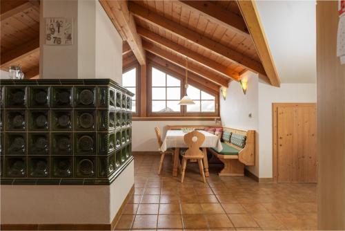 a kitchen with a table and a dining room at Appartements Coburg by Schladming-Appartements in Schladming