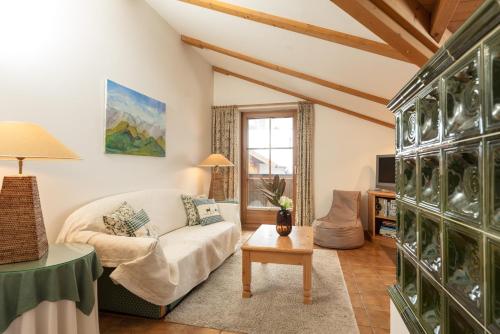 a living room with a couch and a table at Appartements Coburg by Schladming-Appartements in Schladming