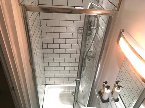 a bathroom with a shower and a sink at Self-contained, private entrance, near city centre in Norwich