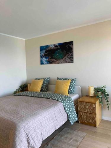 a bedroom with a bed and a couch at Cosy ocean view studio 2 in San Marcos