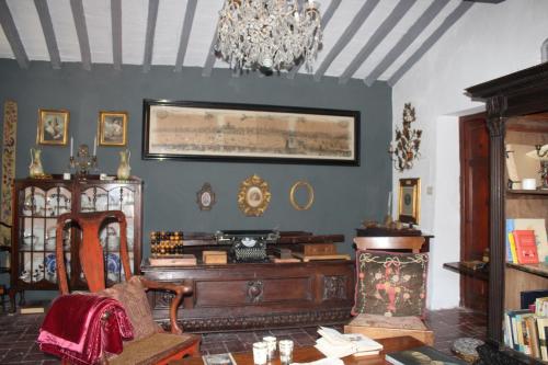 a living room with a table and a chandelier at Casa Ceri in Casoli