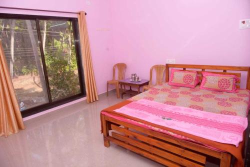 A bed or beds in a room at Yash Homestay