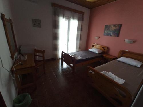 Posteľ alebo postele v izbe v ubytovaní Vila. Dionysos