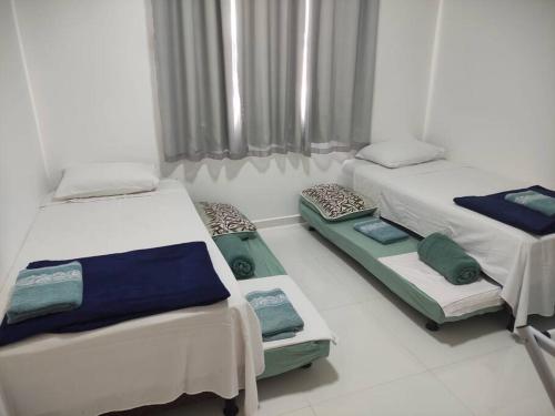 Ένα ή περισσότερα κρεβάτια σε δωμάτιο στο Ap 8Jardins de Taperapuan