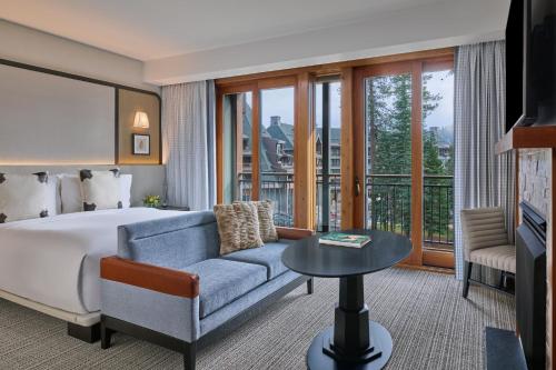 a hotel room with a bed and a couch at The Ritz-Carlton, Lake Tahoe in Truckee