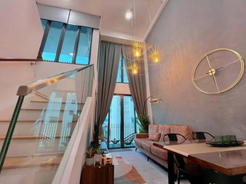 a living room with a couch and a table at Duplex 4px@Colony, Near Quill CityMall & Monorail in Kuala Lumpur