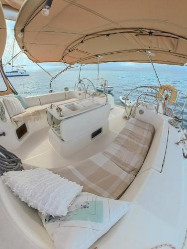 a white boat sitting in the water next to the ocean at Private Sailingyacht "Guji" With Crew All Inclusive in Isla Wichitupo Grande