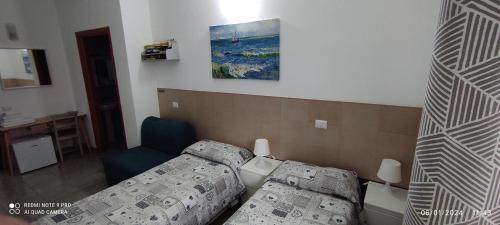 Postel nebo postele na pokoji v ubytování Coccinella