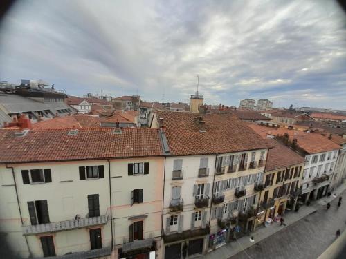a group of buildings with red roofs in a city at VERCELLI CENTRO 1 in Vercelli