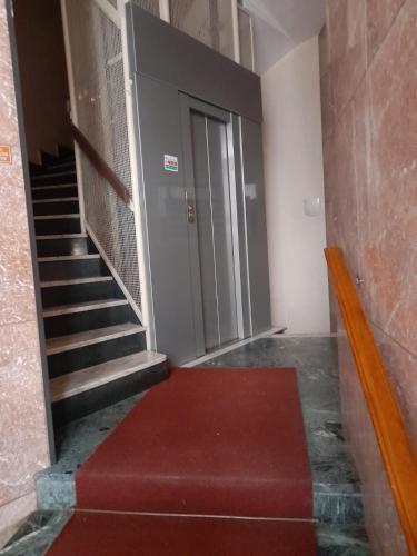 a stairway with a red carpet in a building at VERCELLI CENTRO 1 in Vercelli