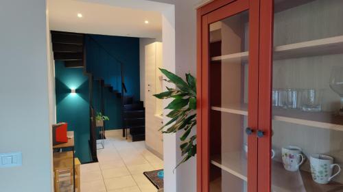 a hallway with a door leading to a room at Cuttigghiu Holiday Apartment in Catania