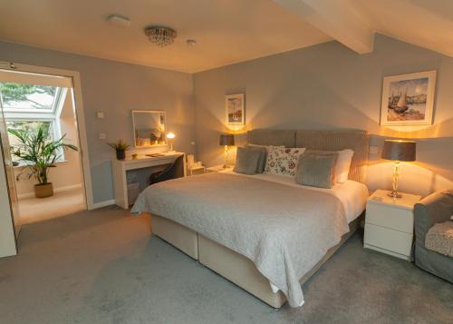 a bedroom with a large bed and a window at MOUNT BARKER in Swords