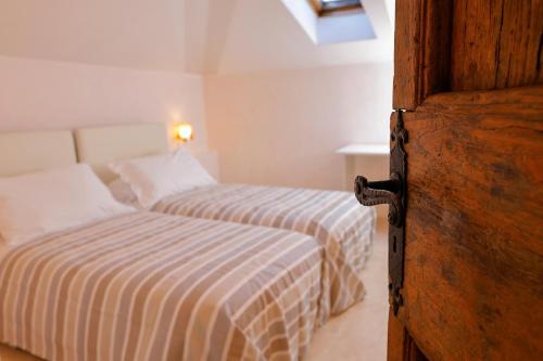 a bedroom with two beds and a lighted at greve center apartments in Greve in Chianti