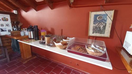 a counter with some baskets of food on it at Las Grullas in Villa Gesell