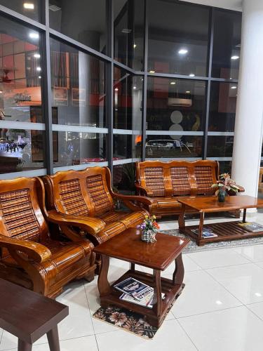 a group of wicker chairs and tables in a store at S8 Boutique Hotel near KLIA 1 & KLIA 2 in Sepang