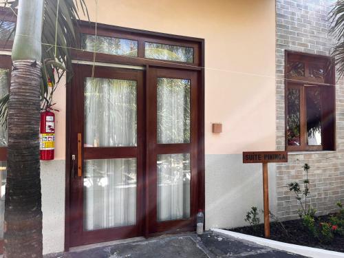 a door to a building with a nice entrance at POUSADA IRMAOS ATINS in Atins