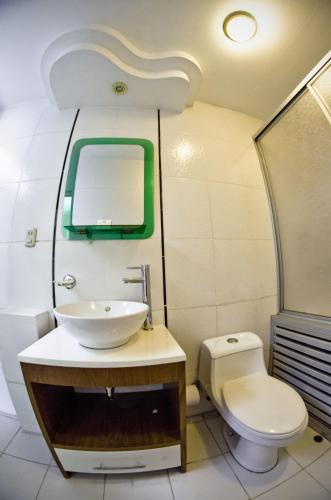 a bathroom with a sink and a toilet at Gran Bolivar Hotel - Trujillo, Perú in Trujillo