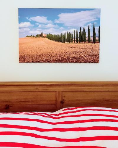 a picture of an american flag laying on a bed at RossoToscano in Piantravigne