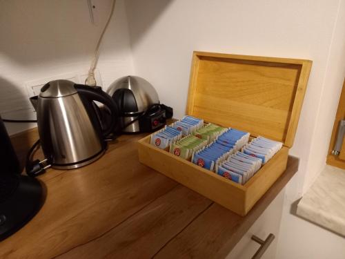 a wooden box with a tea kettle on a table at Lovely Rita, Studio Kaprun in Kaprun