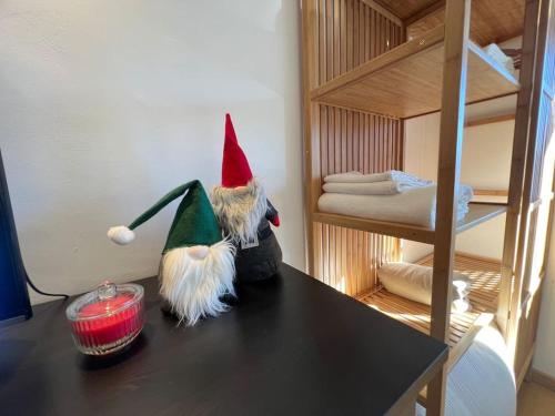 two gnomes sitting on a table in a room at Suite Lady Marian in Roccaraso