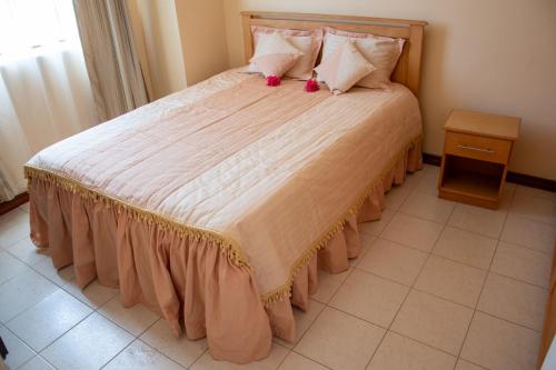 Postel nebo postele na pokoji v ubytování Villa Le Gerbera
