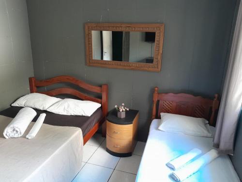 Tempat tidur dalam kamar di Pousada Portobello