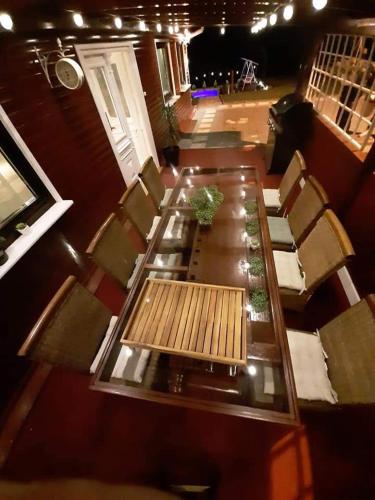 an overhead view of a table and chairs in a room at Holiday House Sunny Hill in Veliko Trgovišće