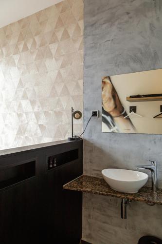 a bathroom with a sink and a mirror at Boutique Hotel View in Amsterdam