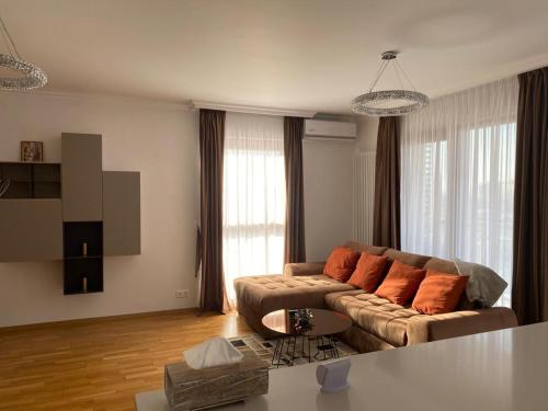 a living room with a couch and a table at Centenar Diamond in Ploieşti