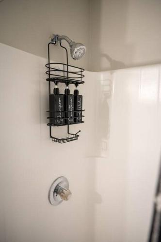a bathroom with a light hanging from a wall at Near Historic Downtown Apex, Sleeps 8, King Bed in Apex