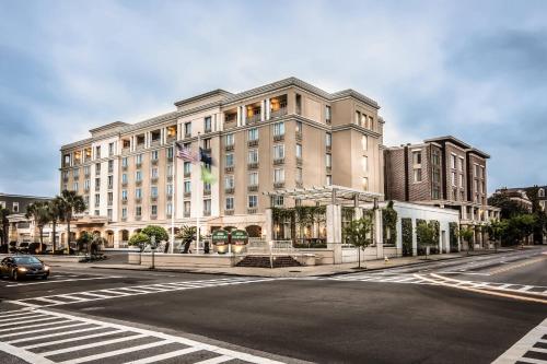 a large building on a street with a road at Courtyard by Marriott Charleston Historic District in Charleston