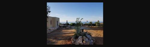 a view of a house with a plant next to it at Damianakis Village Rethymno in Somatás