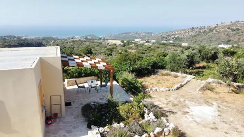 a view of a house with a gazebo at Damianakis Village Rethymno in Somatás
