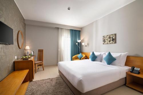 Postel nebo postele na pokoji v ubytování Dhara Residence E2 Lodge Hotel