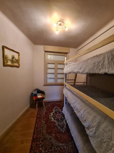 a bedroom with two bunk beds and a window at Spacious Luxury 2 bed appartment in Carcassonne