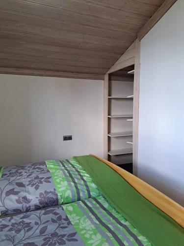 a small bedroom with a bed and a closet at Apartment Sabrina in Sankt Johann im Pongau