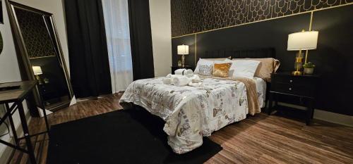 a bedroom with a bed with a white comforter at Luxury 2br Apartment (Buckhead) in Atlanta