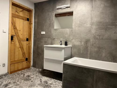 Koupelna v ubytování Apartmány Kanteho grunt