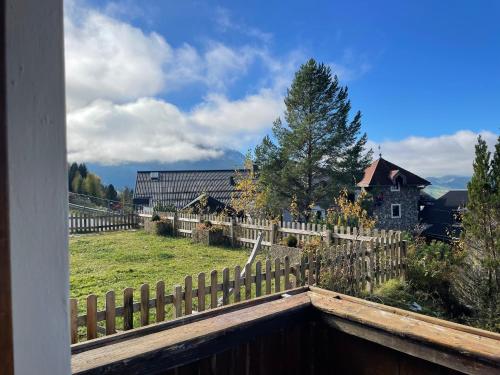 a view of a farm with a fence and a house at Apartment Sabrina in Sankt Johann im Pongau